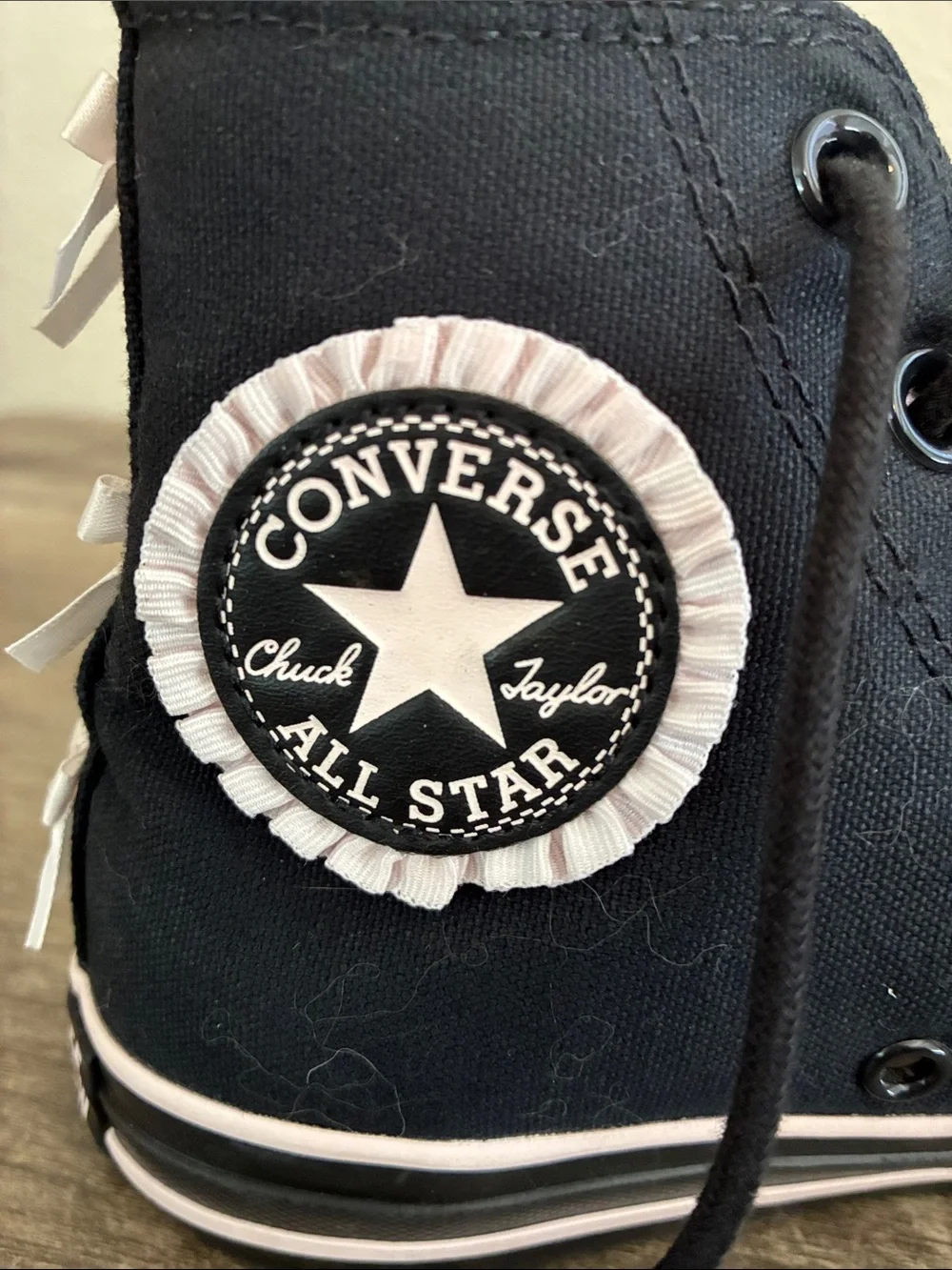 Converse Women’s Black High-Top Sneakers with Light Pink Bows